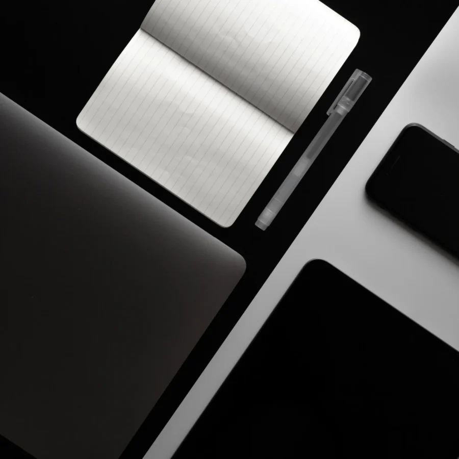 notebook-phone-tablet-black-white-office-desk